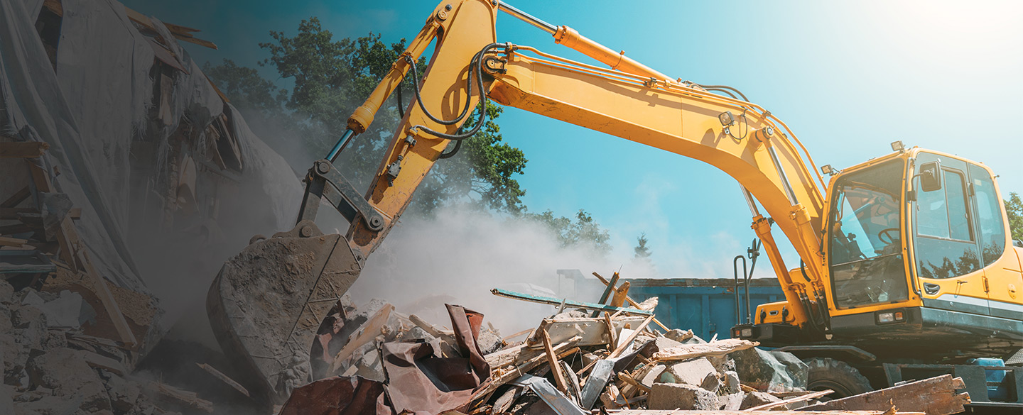 excavator used to demolished a building Missoula MT